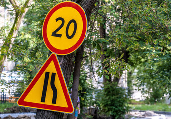 Road sign of Russia narrowing of the road and speed limit.