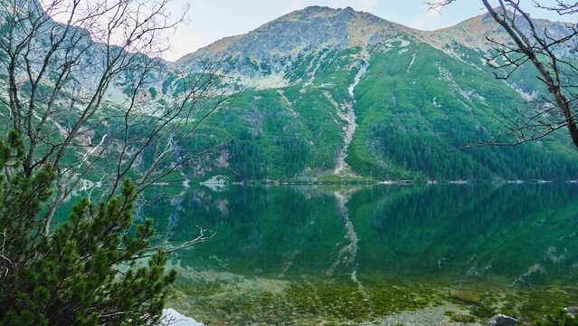Morskie Oko (Sea Eye) is largest and fourth-deepest lake in Tatra Mountains. It is located deep within Tatra National Park, Poland, in Rybi Potok (Fish Brook) Valley, at base of Mieguszowiecki Summits