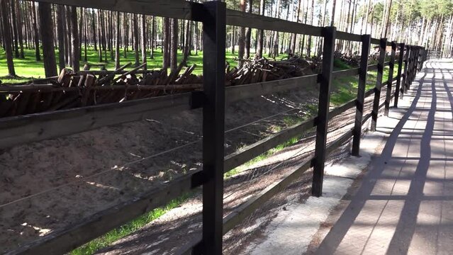 Fence and stockade of logs in a city zoo.