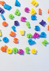 Fridge magnet letters spell donate