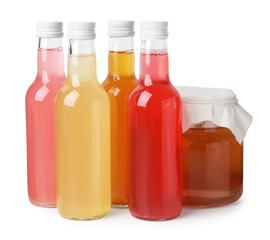 Delicious kombucha in glass bottles and jar isolated on white