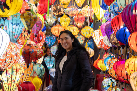Asian tourist among Vietnamese lanterns