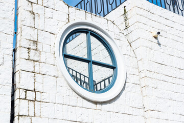Classic circular window on house wall with blue sky,white round window,modern home decor,stylish home decor old apartament house london style.