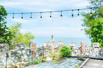 View of the Sea and the lamp on the pole,Summer blue beach and travel vacation.