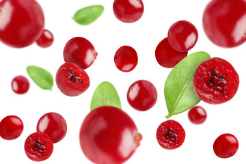 Fresh red cranberries and green leaves falling on white background