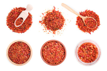 Aromatic spices. Red chili pepper flakes on white background, top view