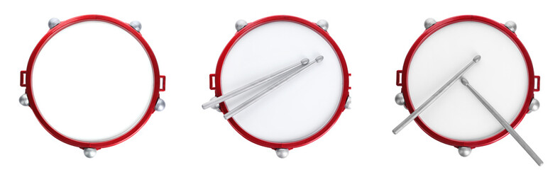Bright toy drums and sticks on white background, top view