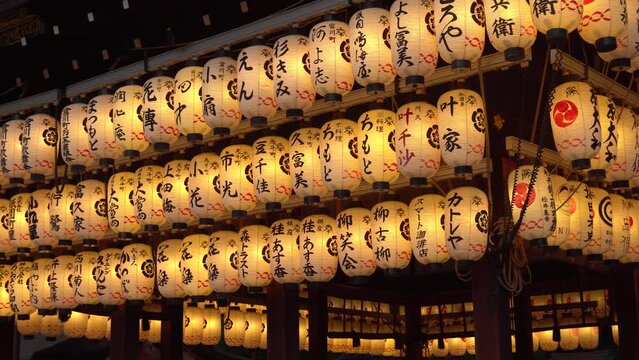 Close-up of Illuminated Papaer Lanterns with Japanese Writing at Shinto Shrine in Kyoto, Japan - Commercially Usable