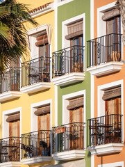 Colorful facades with balconies in Villajoyosa village, Alicante, White Coast of Spain