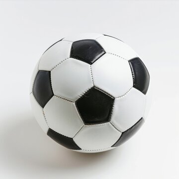 Black and White Soccer Ball on White Surface