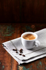 Cup of coffee on rustic wooden background. Copy space.	