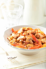 Pappardelle Pasta with chicken breast, red pepper and champignons. Bright background. Close up.	