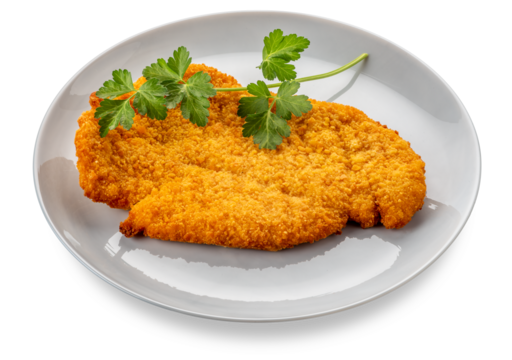 Breaded meat steak fried in dish with parsley leaves, isolated