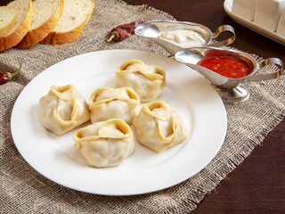 Traditional Uzbek manti with meat. Lunch.