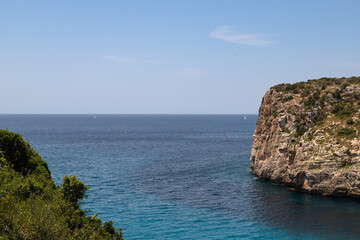 Naklejka premium Natural bay near the Spanish village of Cala en Porter on Menorca.