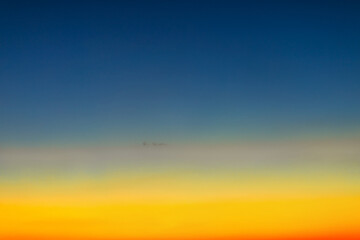 Fototapeta na wymiar Early Light: Dawn's Yellow and Blue Canvas