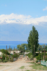 Village at the shores of Issyk-Kul and Tian Shan Mountains, Kyrgyzstan