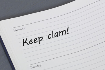 Keep calm reminder message in an open diary