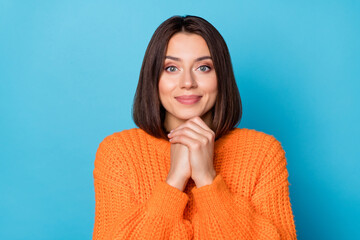 Portrait of attractive pleased cheerful girl enjoying good mood isolated over bright blue color background