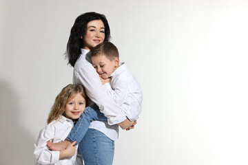 Little children with their mother on white background. Space for text