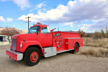 old fashioned red firetruck in the desert ghost town