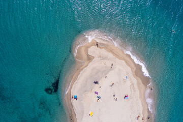 Aerial view of exotic sandy peninsula and sandy beach of Posidi with turquoise clear sea,...