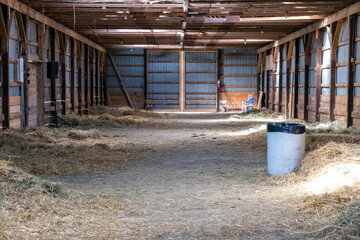 An old barn filled with hay.