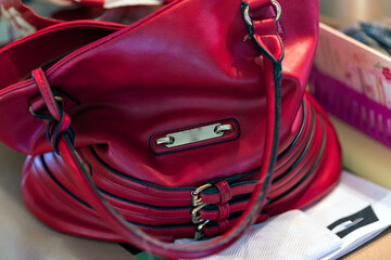 A women's or mans red handbag. 