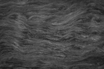 black mineral wool with a visible texture