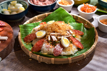 Xoi man, or sticky rice, a Vietnamese cuisine. Sticky riced is cooked then steamed and added with topping such as pork sausage, pork floss, oiled scallions, and cooked eggs. A delicious street food