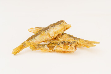 Fried small river fish on white background