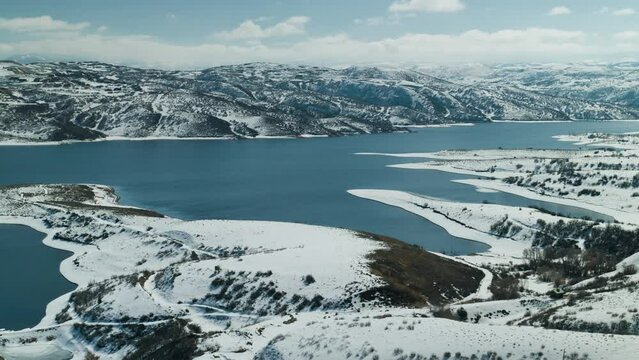 Aerial View of Reservoir and Ski Slopes in High Mountain Town in Utah