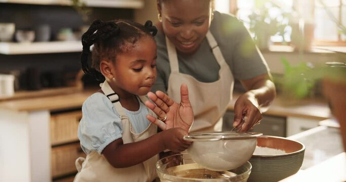Mommy, daughter and flour for baking pastry in kitchen, education and learning for child development. Black family, home and love for cookie or cake, cooking and support while bonding on weekend