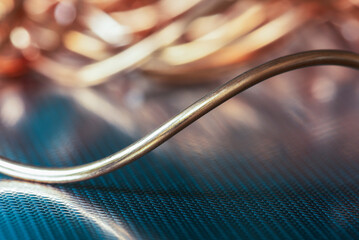 Shining copper wire on metal surface with toned background, raw material and metallurgy industry