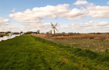 Mill and dyke in the village of in the heart of the Norfolk Broads