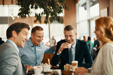 Business people having a meeting at an indoor cafe