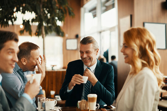 Business people having a meeting at an indoor cafe - Powered by Adobe