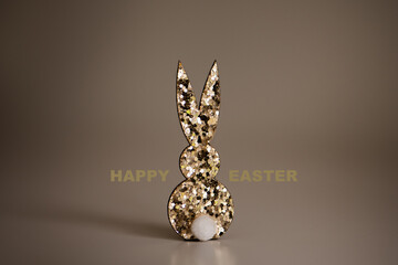 Golden glitter bunny, with "happy easter" lettering, gold/brown touch