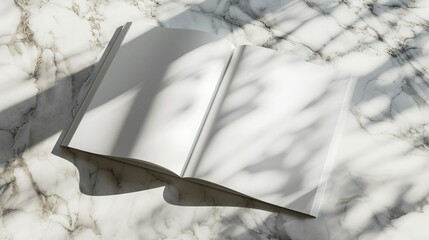 Blank magazine mockup on marble table. Open book with white pages.