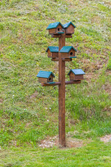 Multiple Bird Houses on One Wooden Pole