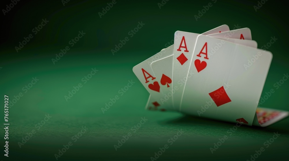 Poster Four playing cards neatly arranged on a table, suitable for various card game concepts