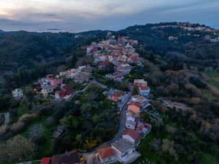 Aerial drone view of Antiperni village in north corfu, Greece by night