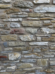 background, natural pattern, antique stonework made of multi-colored stones