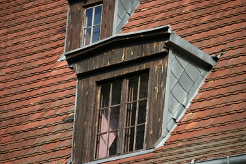 Fototapeta premium Old house with red tiles and dormers
