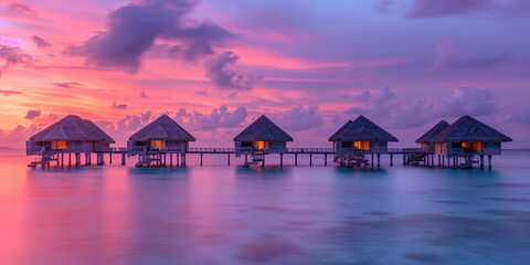 Fototapeta premium Serene Sunrise Over Tropical Overwater Villas
