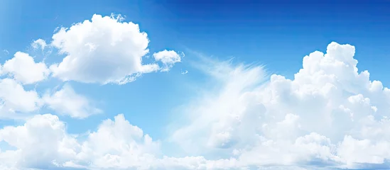 Fototapeten Large cloud over water with bright blue sky © Ilgun