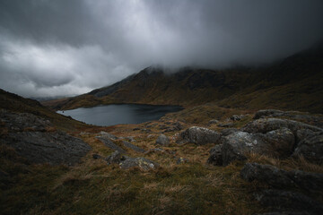 A mountain lake shrouded in cloud