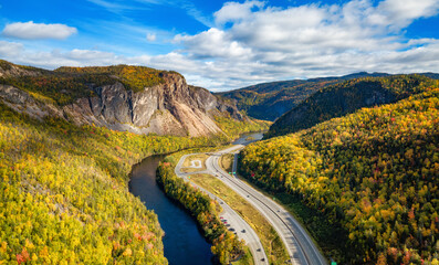 Scenic road in Canadian Mountain Landscape Valley with River. Fall Season. Corner Brook, Newfoundland, Canada - obrazy, fototapety, plakaty