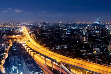 Fototapeta na wymiar Expressway Arial View During Night With Light Trail Bang Na Bangkok Thailand