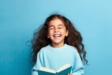 Photo of optimistic happy little girl hold read book study wear pullover isolated on blue color background -  generative ai